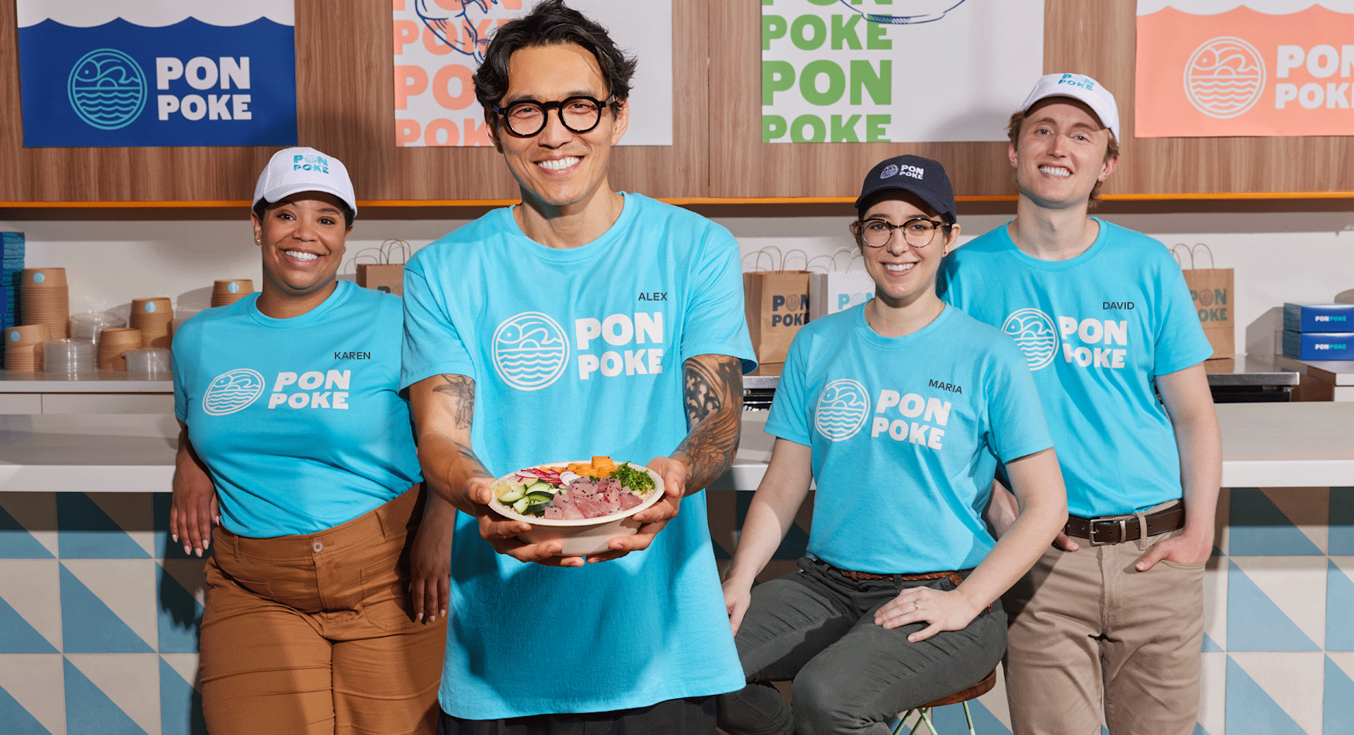 Restaurant employees wearing matching T-shirts.