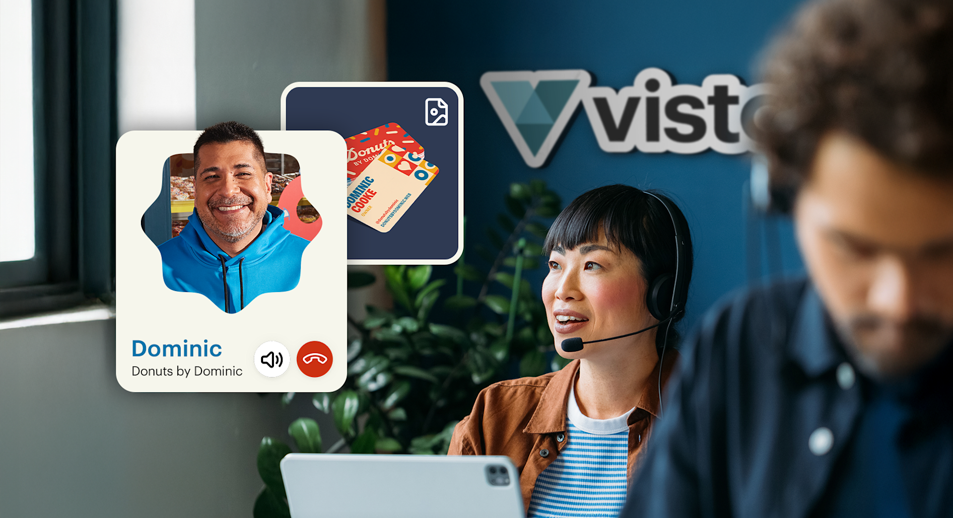 A customer support agent talking on a headset and smiling.