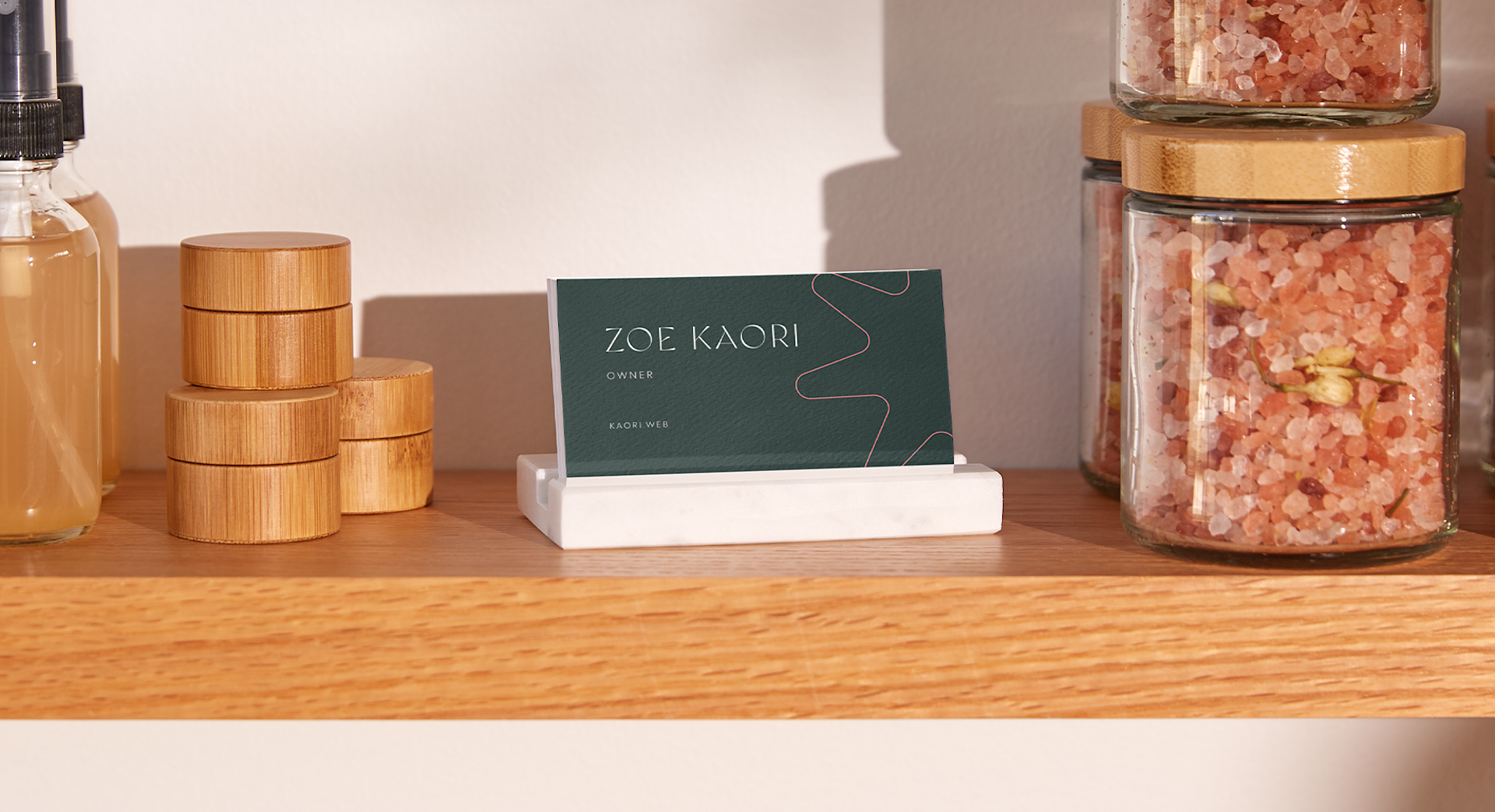 A business card displayed in a business card holder.