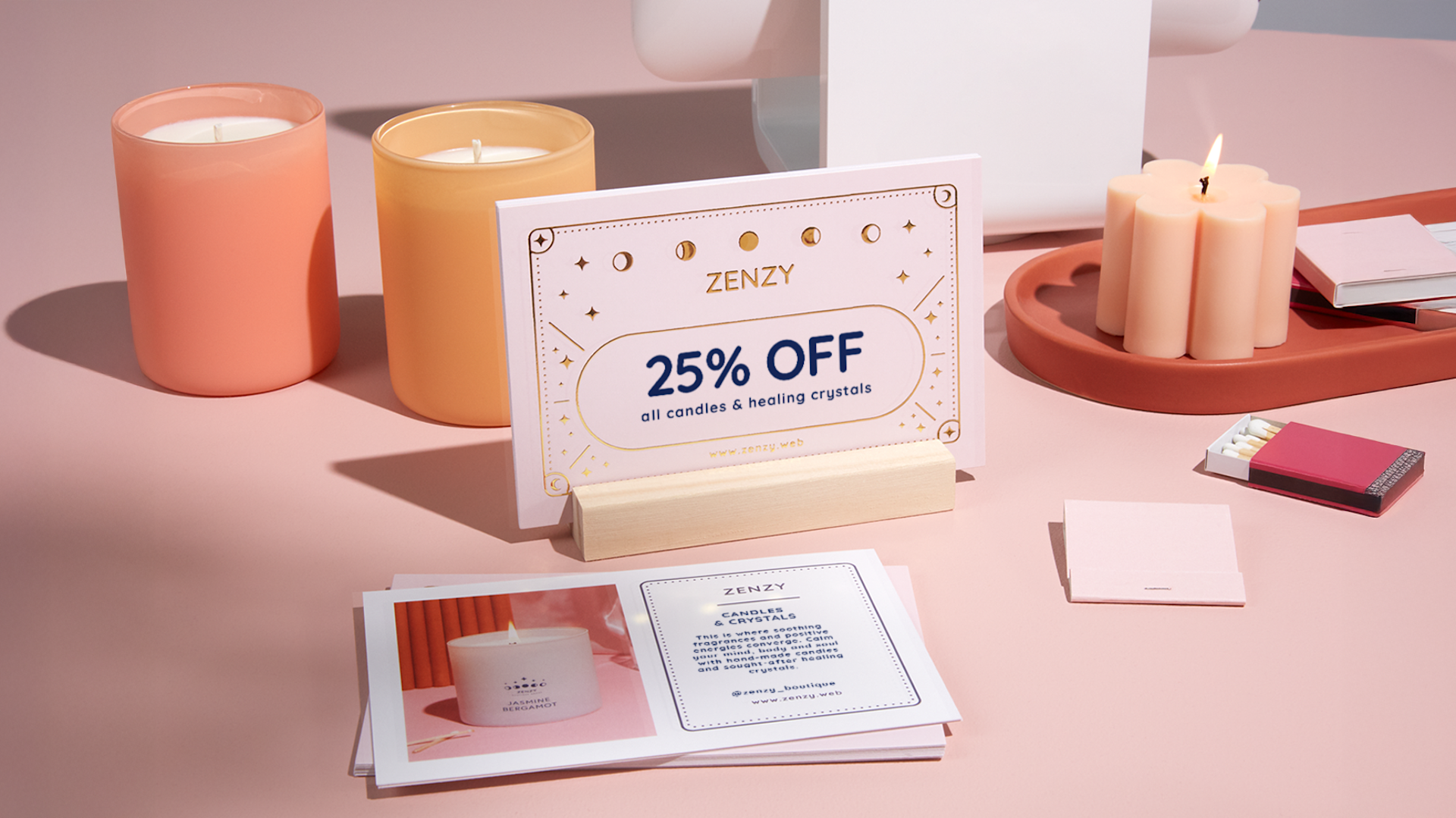 A coupon postcard for a boutique with candles and more postcards on display. 