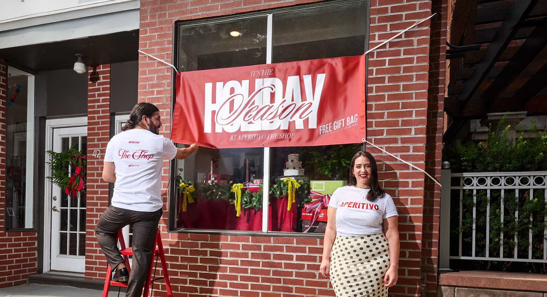 An outdoor market stand, featuring a custom flag, A-Frame sign, tablecloth and tent. 