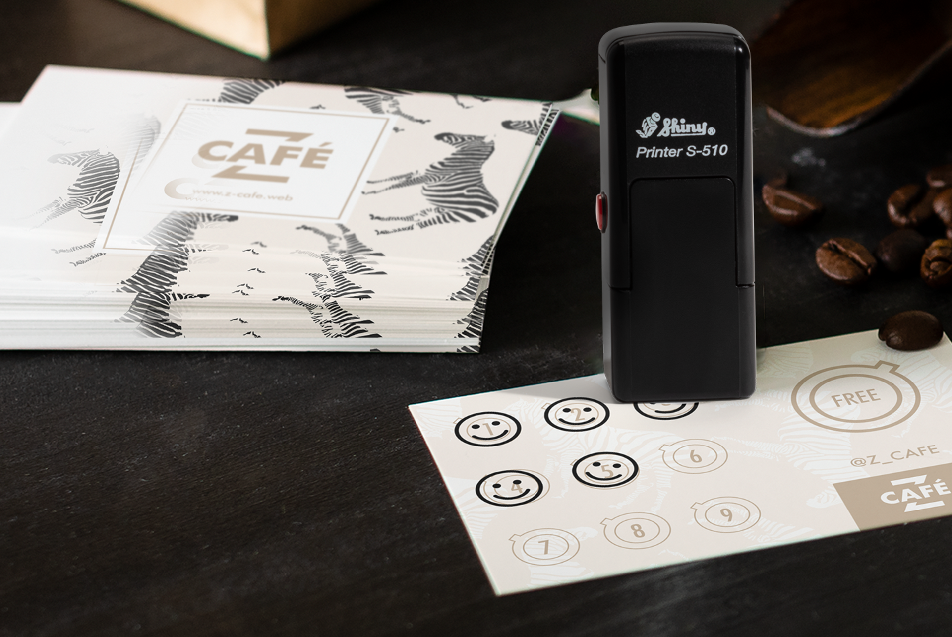 A café loyalty card stamp next to a cup of coffee.