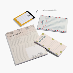 Printed notepads featuring an illustration of a couple.