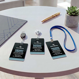 2 branded ID badges for event credential display, suspended on a blue lanyard.
