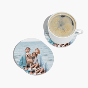 A circle coaster set customized with a family photo, and one shown below a cup of coffee.  