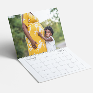 photo calendar showing young child and pregnant mother