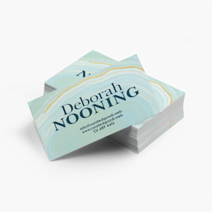 A stack of personal, soft touch business cards for a person named Deborah Nooning.