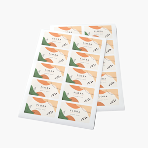 Two overlapping sheets of business card stickers promoting a florist business.