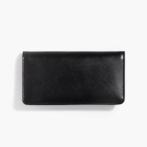A closed black leather checkbook cover with white stitching around the border on a white background.