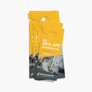 A stack of door hangers promoting electrician services.