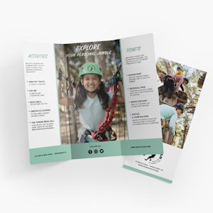 An open tri-fold brochure for an outdoor adventure park, with a closed brochure behind it.