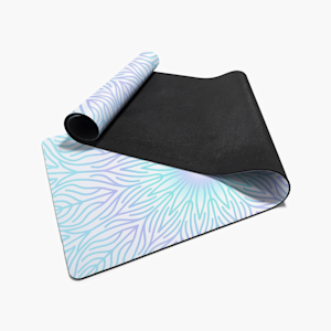 A partially folded yoga mat printed with an abstract lotus design.