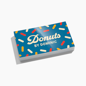 A stack of colorful, glossy business cards from a donut shop.