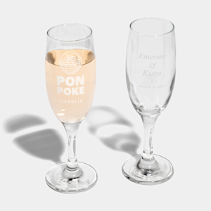Two champagne flutes, one with a design for a business, one for a wedding.