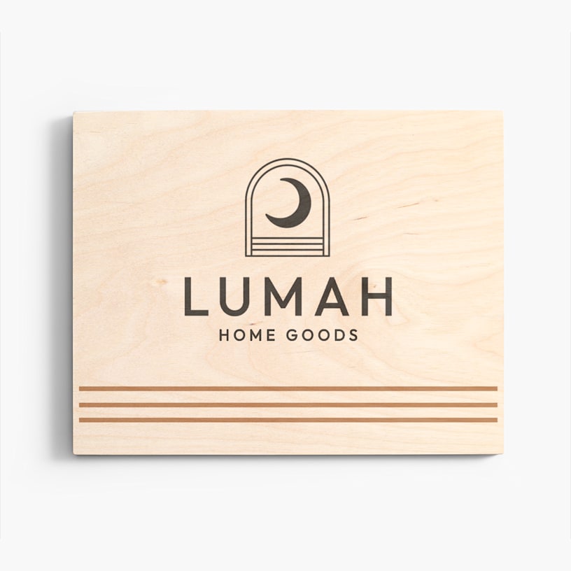 A wood print customized with the name and logo of a home goods boutique. 