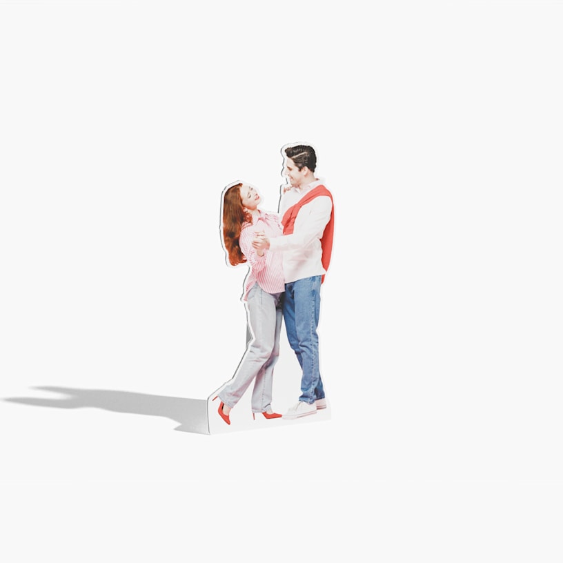 A life-size cutout of a man and woman dancing.