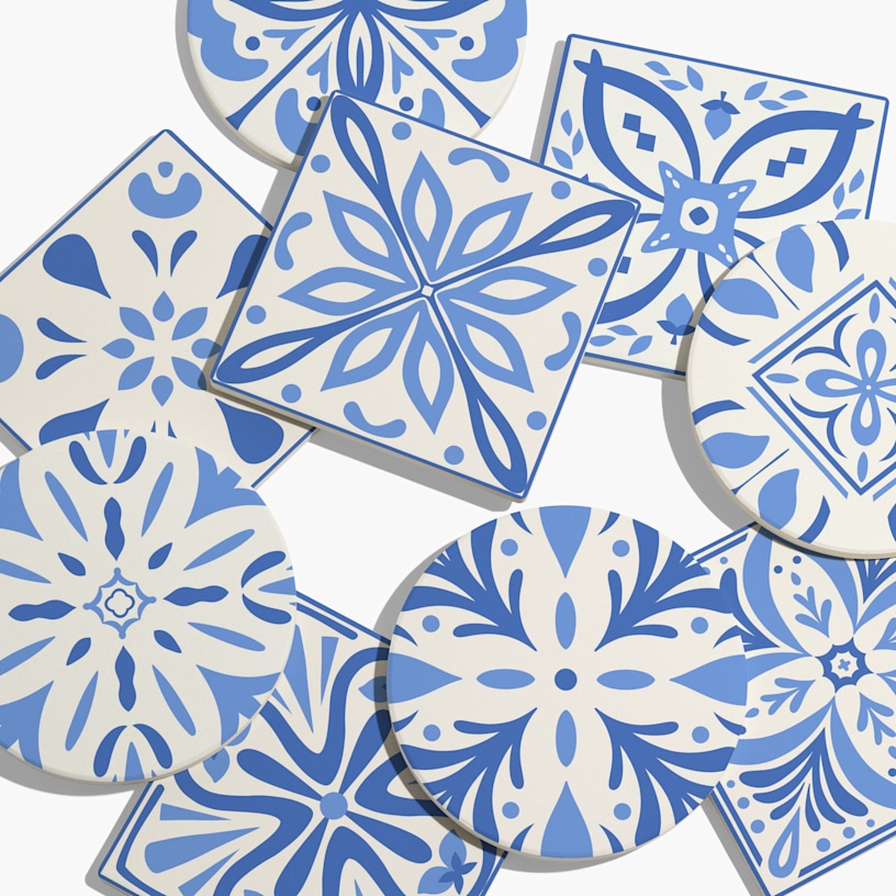 Ceramic coasters in a variety of shapes customized with blue Spanish tile designs.  