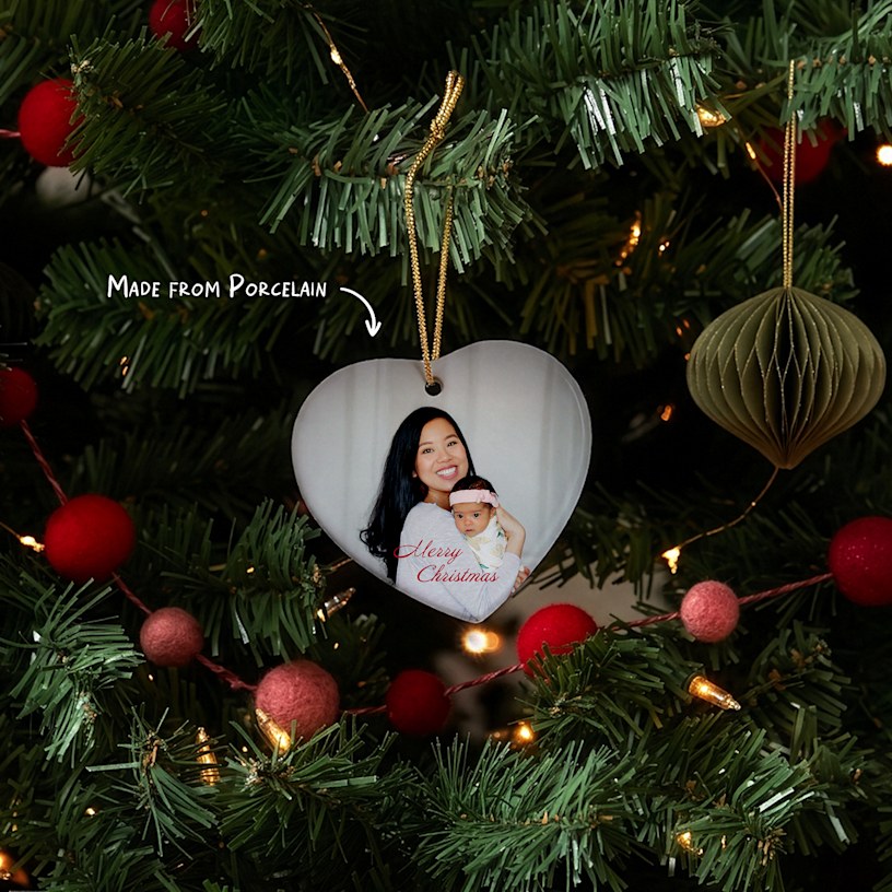 Six different Christmas ornaments featuring photos and text, side by side. An arrow points to the porcelain material. 