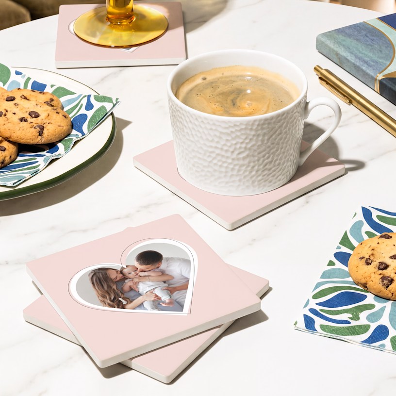 A square ceramic coaster set customized with a family photo. 