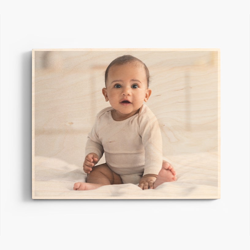A custom wood print featuring a baby photo. 