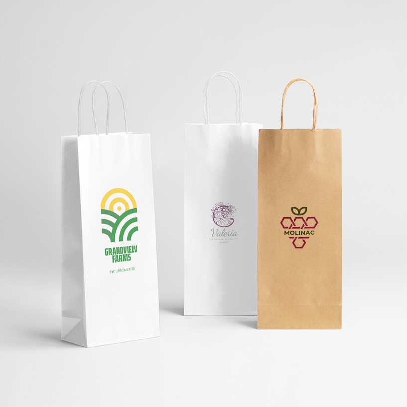 2 white and 1 brown kraft wine bags in a row with logos on them.