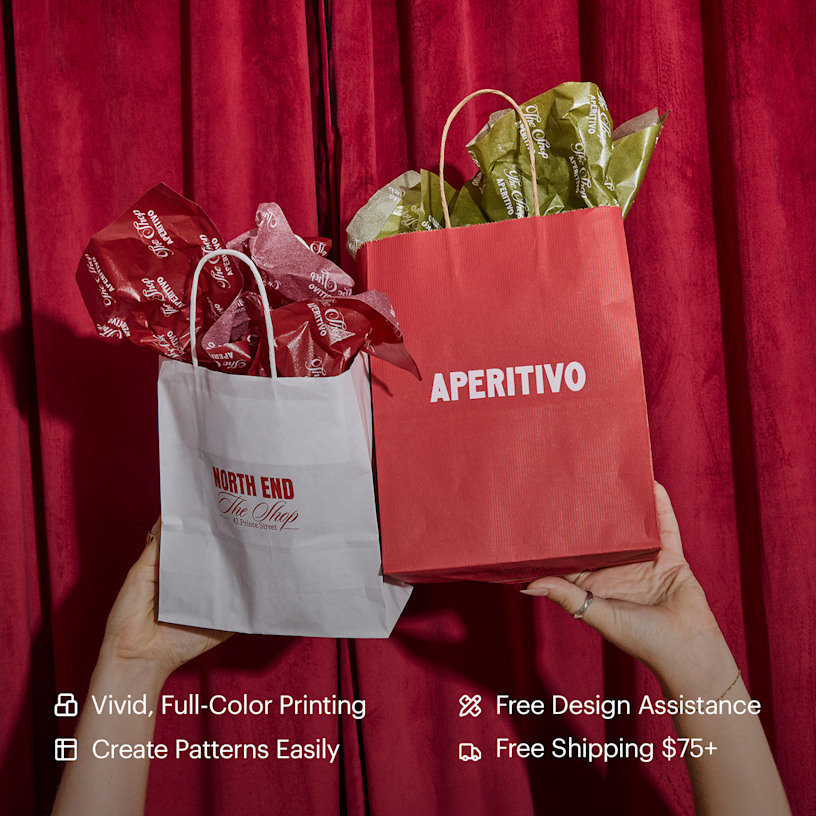 A pair of hands holding up two paper bags filled with tissue paper customized for an Italian restaurant. Highlighted benefits include full-color printing, free design assistance, free shipping and the ability to create your own tissue paper pattern.