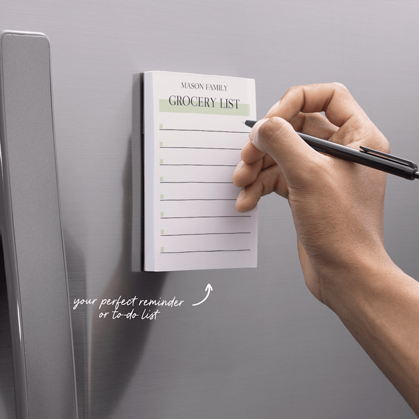 A personalised notepad featuring a family's grocery list.