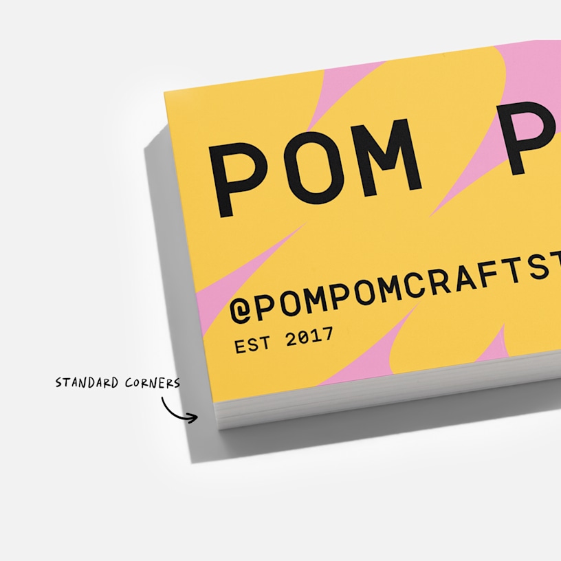 A closeup of a business card with standard corners.