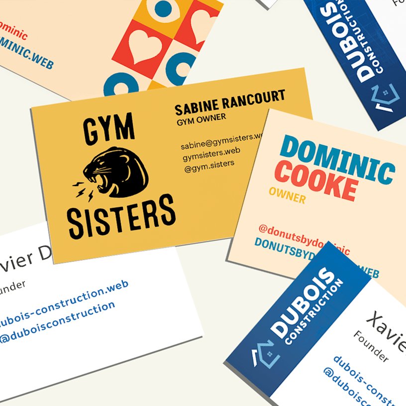 Business cards promoting a construction business, a gym and a donut shop, side by side.