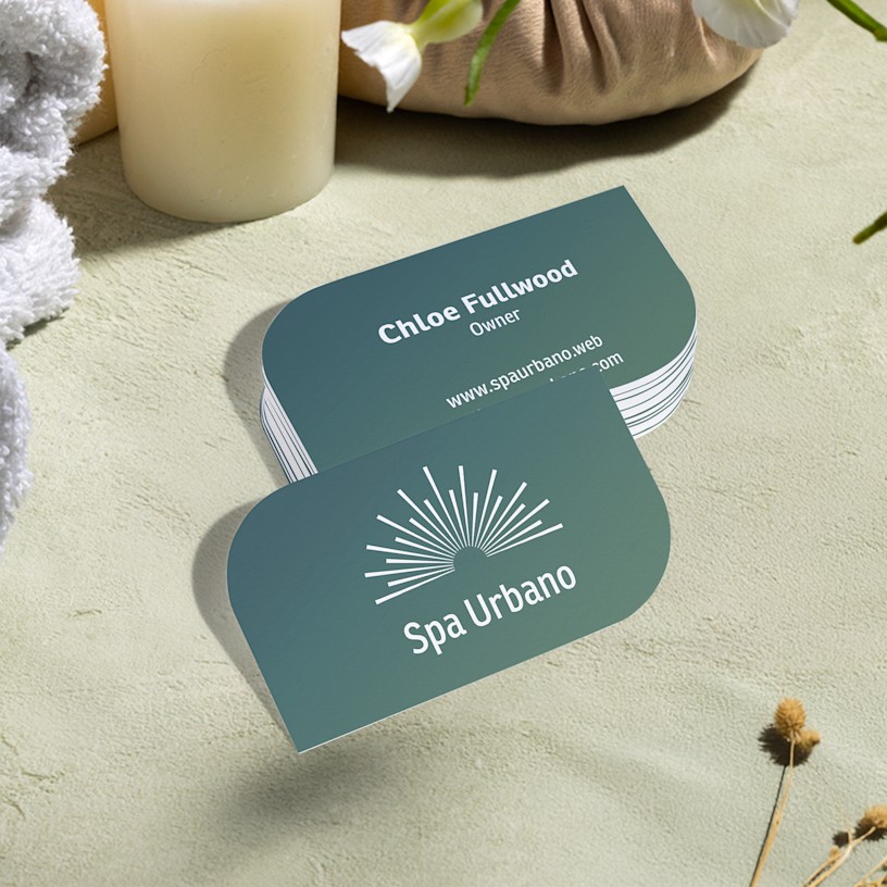 Leaf shaped business cards promoting a spa, with 2-sided printing.