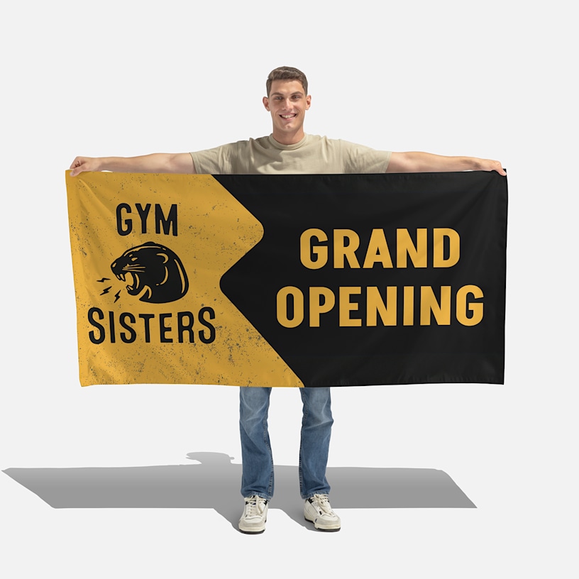 A wall flag promoting a construction business, displayed at the corner of a building.