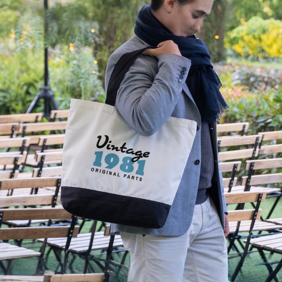 A custom canvas tote bag personalized for a small business that makes vintage goods. 