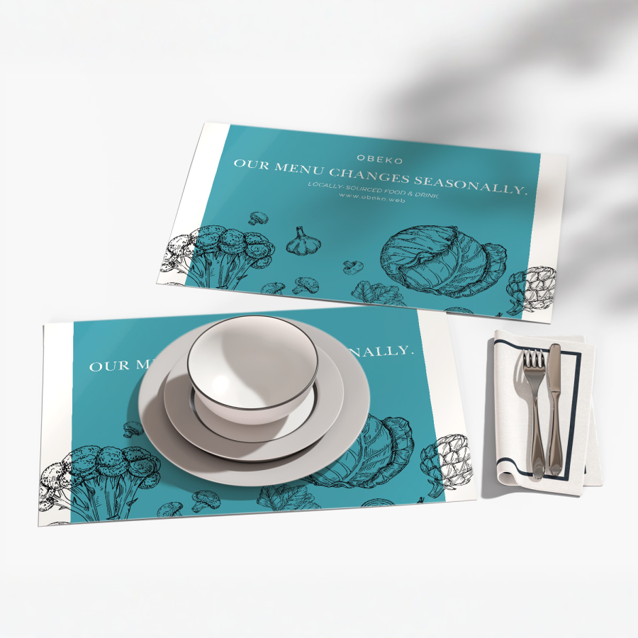 Two placemats with one in use, with information about their menu and website.