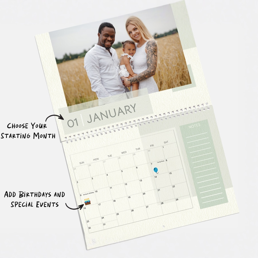 A personalized wall calendar open to a photo of two parents and their baby, with a note that you can choose the starting month of your calendar and also add birthdays and special events. 