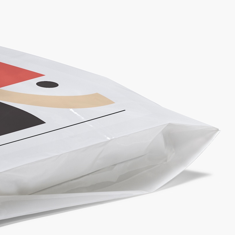 A close up of the bottom of a Die-Cut Handle Bag showing the gusseted option.  