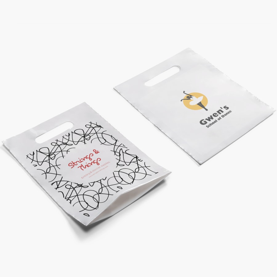 Two Die-Cut Handle Bags, one gusseted and promoting a knitting supply store, and the other not gusseted promoting a dance studio.