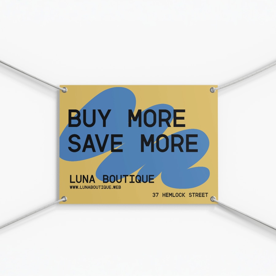 A clothing boutique yard sign shown hanging up with grommets and rope.