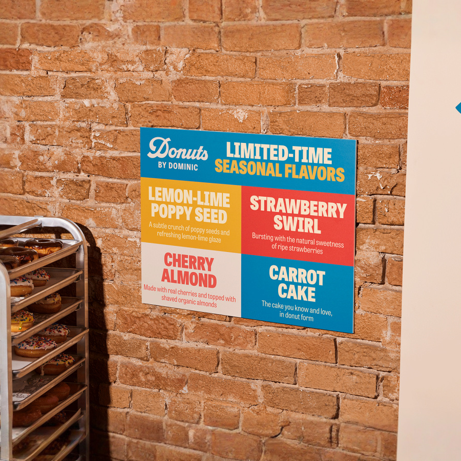 A foam board hung on a brick wall.