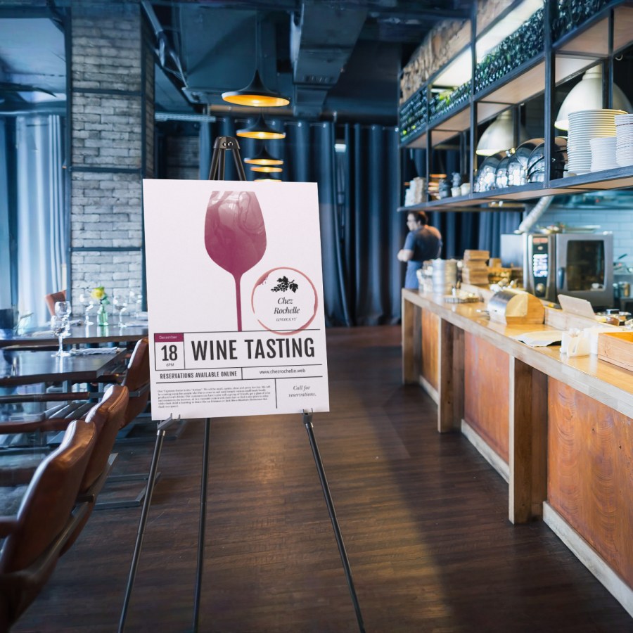 A foam board displayed on an easel inside a restaurant.