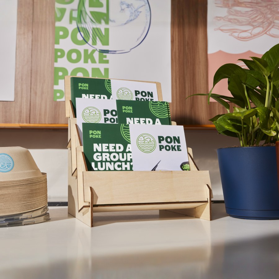 A display of postcards for a restaurant. 6 different sizes are shown. 