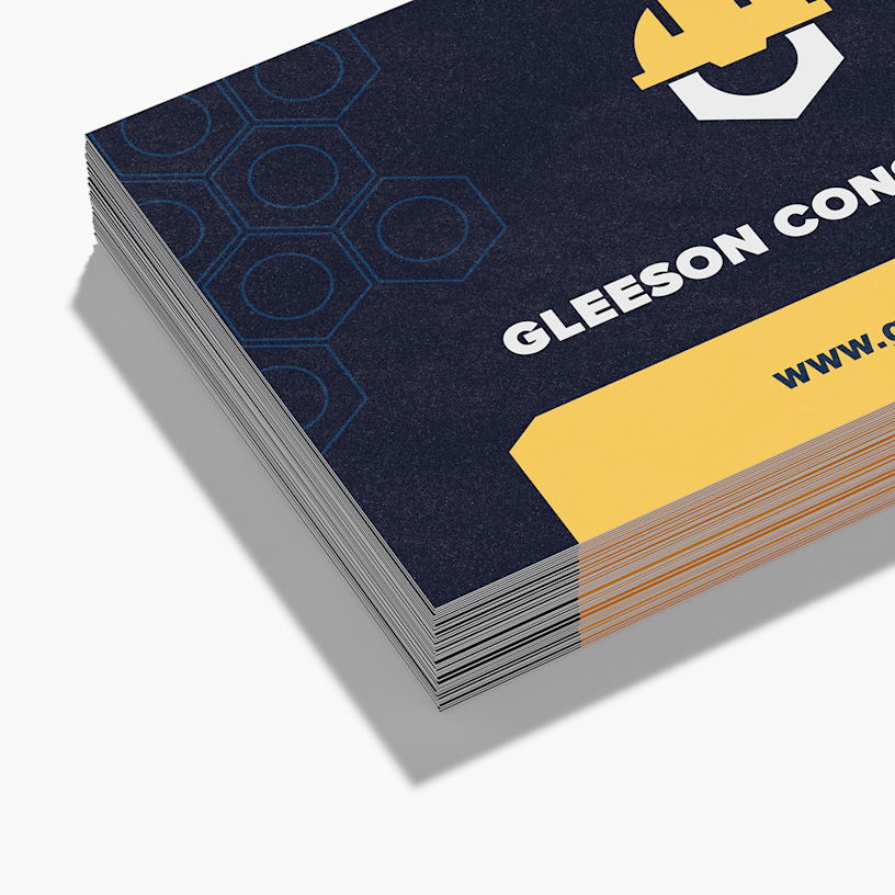 A stack of fine grit business cards for a construction company.