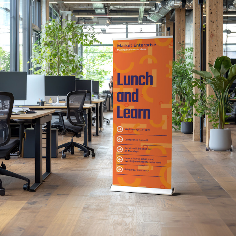 A lunch and learn retractable banner in an office setting.