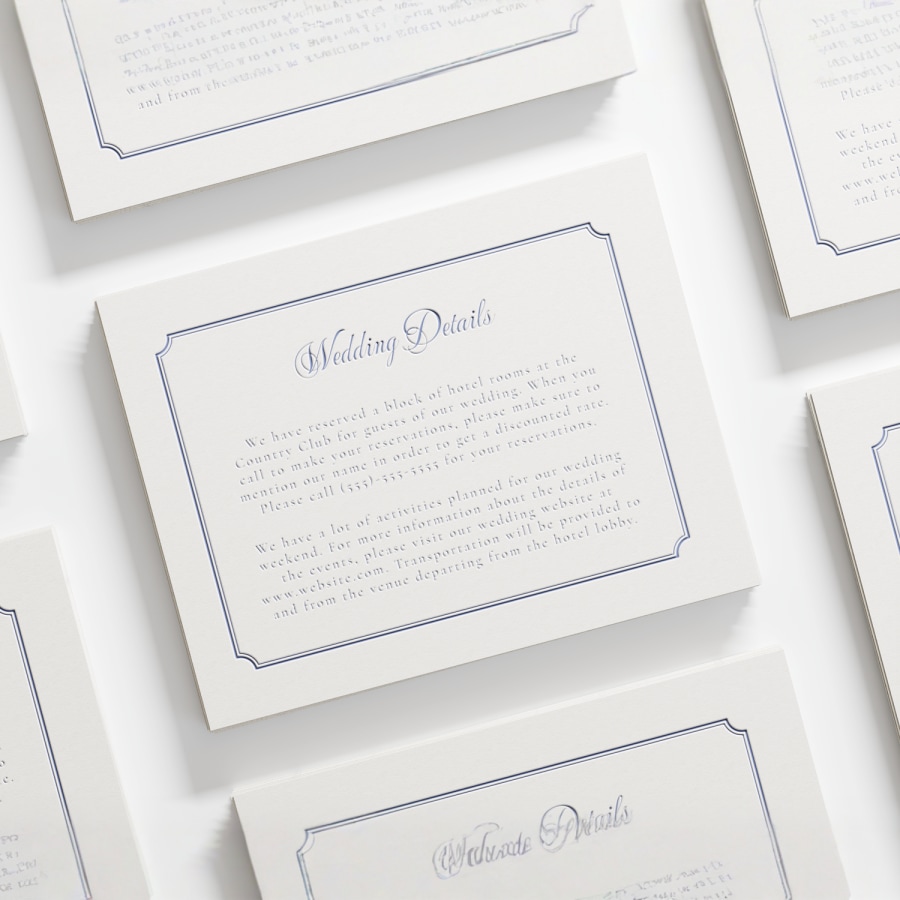 A letterpress enclosure card with elegant script and an antique-style border. 