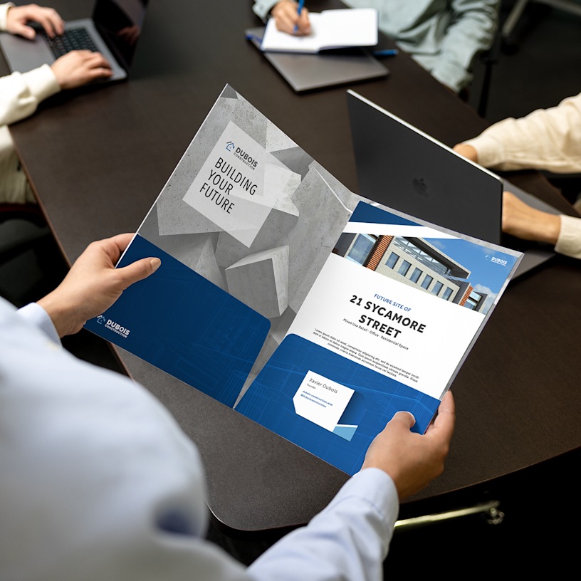 A presentation folder, customized with information about a building for sale.