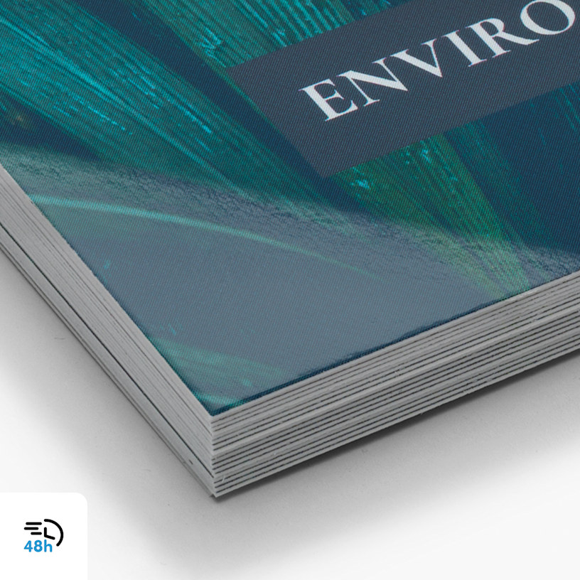 A close-up of a stack of teal and blue glossy business cards, with a 48-hour delivery icon in the corner.