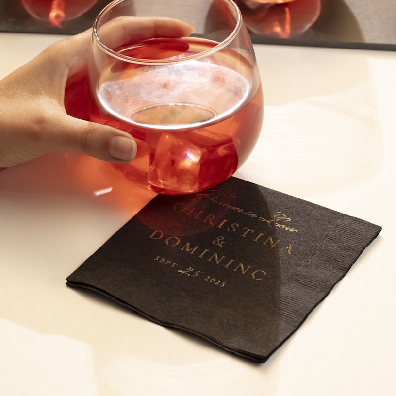 A custom foil napkin for a wedding printed with gold foil. 