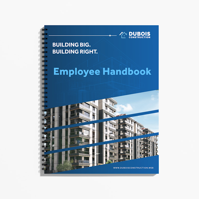 A wire-bound employee handbook for a construction company with a blue cover featuring residential building imagery.