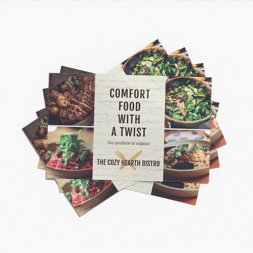 A stack of placemats from a bistro showing some of their menu items and letting customers know that their food is organic.