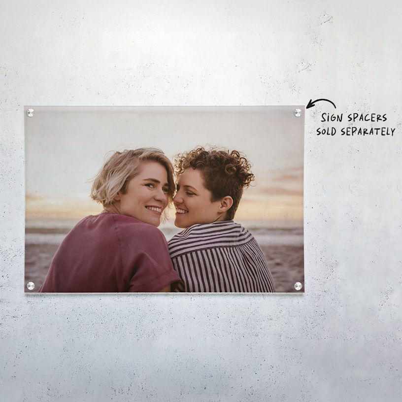 An acrylic print featuring a young couple at the beach. 