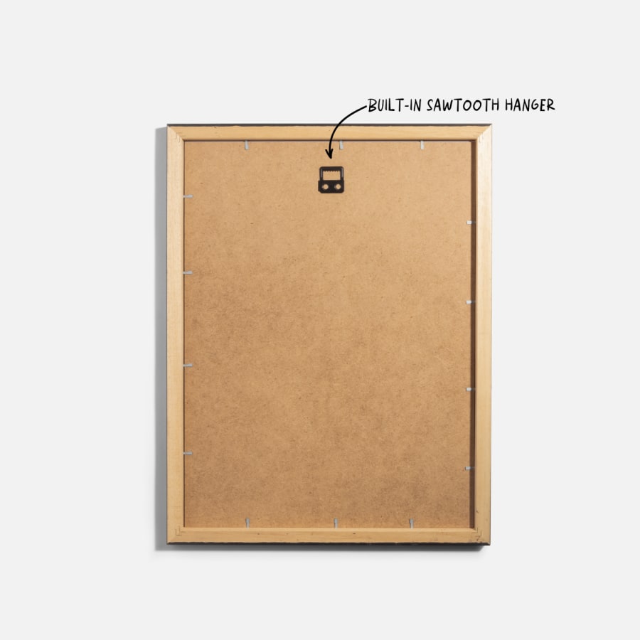 The back of a framed print, with a note pointing to its built-in sawtooth hanger. 